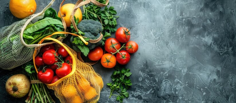 Eco friendly shopping with fresh produce in reusable mesh bags promotes the zero waste concept in a copy space image