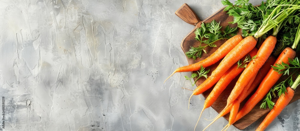 Poster A wooden board displaying fresh carrots against a light backdrop with spacious copy space image