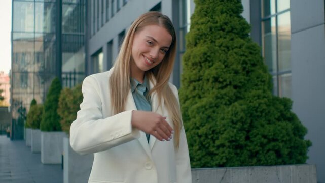 Happy Caucasian businesswoman female woman glad manager in city urban outdoors point finger at camera you come join business gesture. Confident smiling student girl inviting beckon waving hand welcome