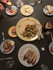 Dinner table with food for a family or friends.  
