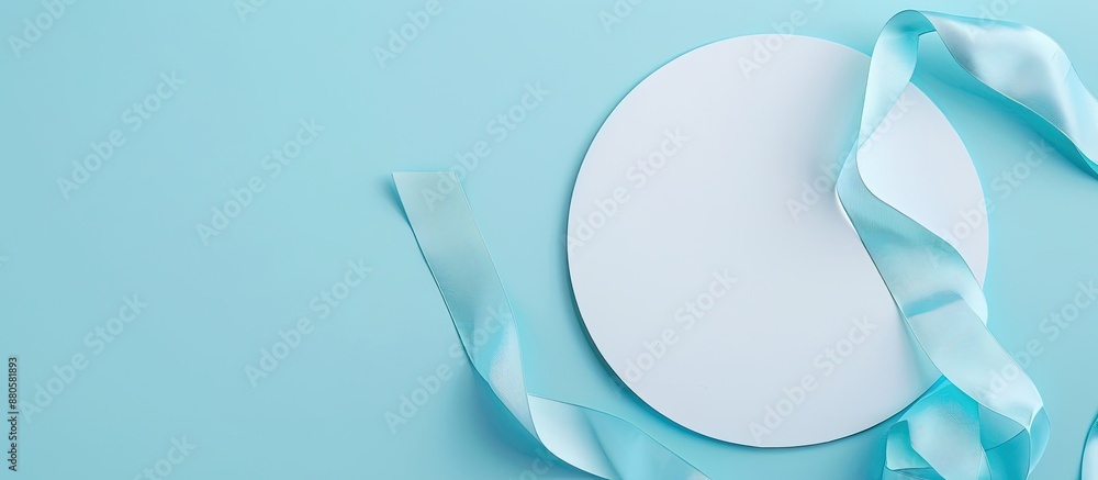 Aufkleber An overhead perspective of a vacant white circle adorned with a soft blue ribbon on a bright isolated backdrop perfect for adding text or images. copy space available