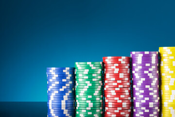 Casino chips on a black surface