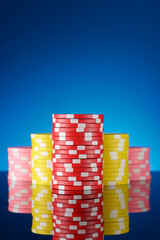 Casino chips on a black surface