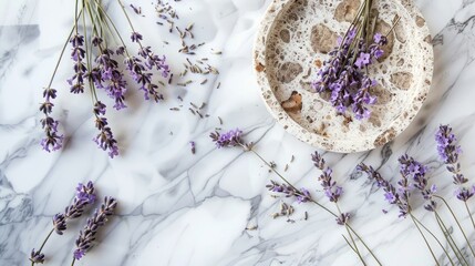 Preserved lavender flowers and table setting on white marble surface top view