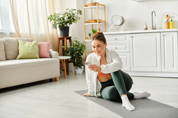 Middle-aged woman deeply focused on her phone while sitting on the floor.