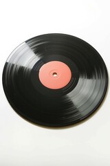 Fototapeta premium A close-up shot of a black vinyl record with a pink disc, often used in music-related designs