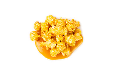 Sweet caramel popcorn isolated on white background. Salted caramel popcorn. Caramel sauce. Close up. Topping.