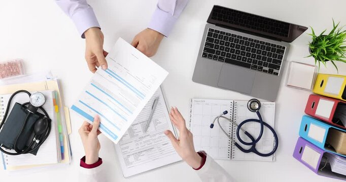 Medic gives health insurance claim to patient in hospital