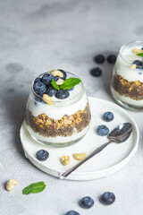 Granola with yogurt, chia and blueberries in a glass