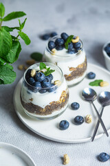 Granola with yogurt, chia and blueberries in a glass