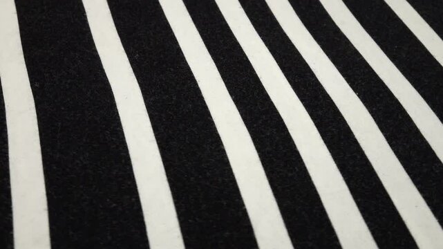 White thin fabric with wide black stripes, background