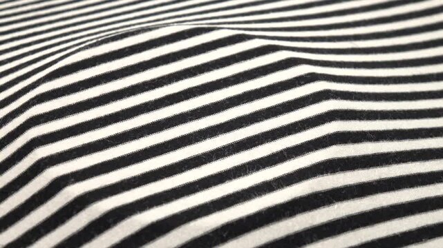 White and black thin striped fabric, background