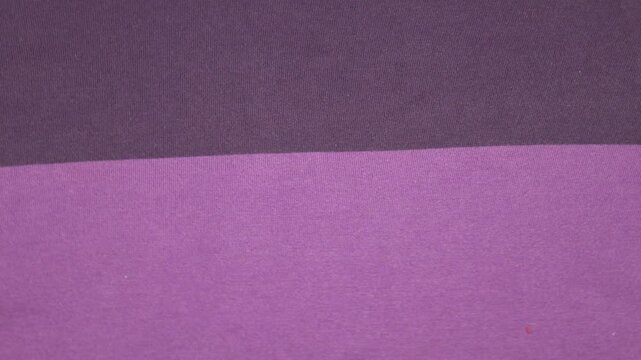 Purple fabric with wide pink color stripes, background