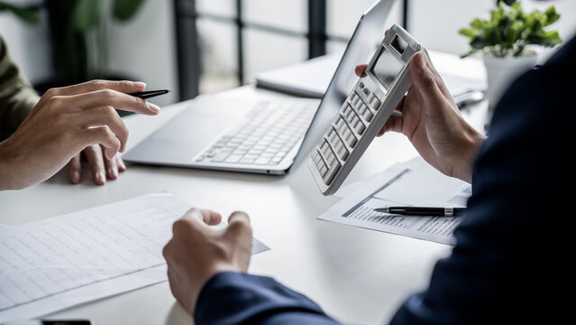 Business Professional Chartered Accountant Woman working with computer and calculator Sales Invoice Accounting