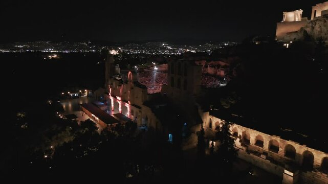 Aerial footage over the Odeon of Herodes Atticus at Evening