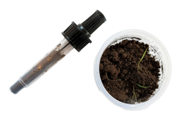 A soil tester kit featuring a testing probe and a container of soil, ideal for analyzing soil quality in gardening.
