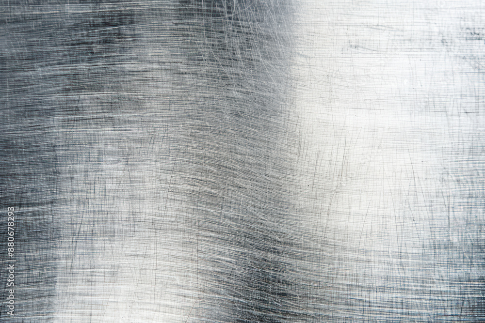 Poster close-up of a scratched, brushed silver metal surface with distinctive texture and patterns. ideal f