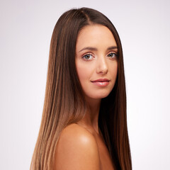 Fototapeta premium Portrait, skincare and hairstyle of woman with glow or shine isolated on white studio background. Face, hair care or confident model in makeup at hairdresser salon for cosmetic, beauty or dermatology