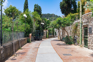 Via Tragara, scenic pedestrian pathway leading to Belvedere Tragara Faraglioni panoramic view area in Capri Island, Italy.