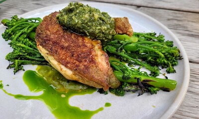 Baked crispy pearl barley, purple sprouts, capers and raisins tenderstem broccoli