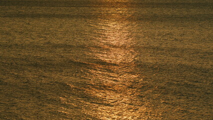 Blue Sea Water Surface With Sparks. Shiny Sparkling Sunlight Reflection In Water With Bokeh Of Sun...