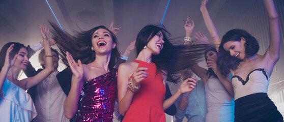 Low angle top view of gorgeous, nice, stunning, adorable, good-looking ladies in skirt, dress rest relax and chill on party in night club raised hands up