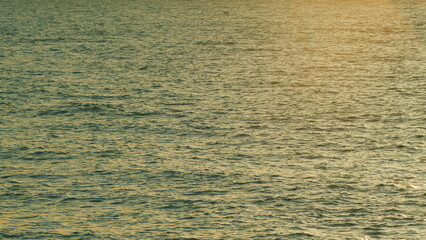 Sun Reflection On Water Surface. Sea Water With Sun Glare And Ripple. Blue Water Texture. Real time.