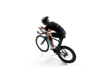 Aerial view of cyclist, determined athlete in professional attire and helmet, riding bike isolated on white background. Concept of sport, competition, tournament, speed, endurance. Isometric view