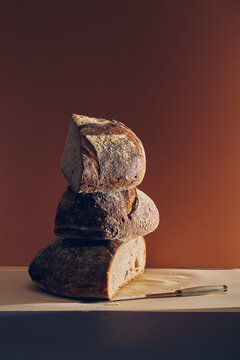 three pieces of bread stacked on top of each other on beige surface
