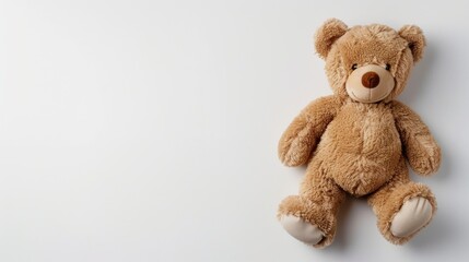 Obraz premium Simplified design featuring toy bear on white background Concept of caring for children and family Top view with copy space