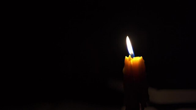 Candlelight in the dark Candle flame in the dark flames on black background