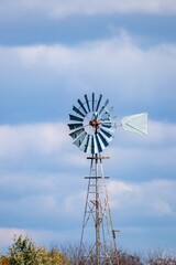 wind turbine in the field against blue sky 