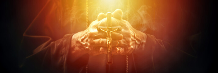 Christian priest hands holding cross while praying, Jesus Christ, praying to God, heaven and salvation, faith and love, easter, New Testament, Biblical theme concept.