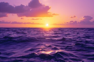 Obraz premium Yellow Sunrise. Beautiful Purple and Yellow Sunrise Over the Ocean with Cloudy Sky