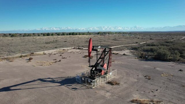  Aerial view of oil pump, AIB, near Route 40. Nevada Andes mountain range in the background.