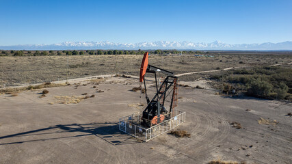  Aerial view of oil pump, AIB, near Route 40. Nevada Andes mountain range in the background.