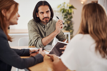 Business, employees and tablet at office with client on meeting with online research for creative ideas. People, teamwork and collaboration for project or task as graphic designer in boardroom