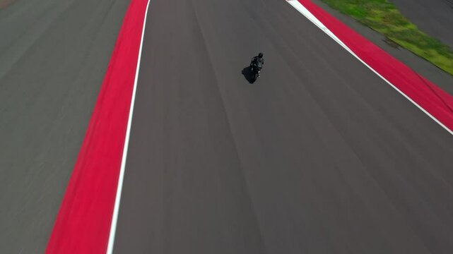 A motorcyclist rides on a race track. Motorcycle racer training.
