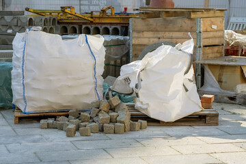 Granite street paving stones in bag at a work site