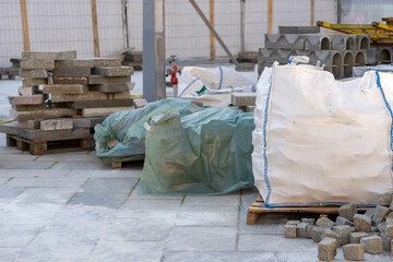 Granite street paving stones in bag at a work site