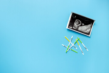 Ovulation and pregnancy tests with Ultrasound image of a baby. Pregnancy and conceiving a child...