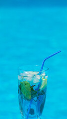 A glass of milk standing on a green lawn in the backyard.