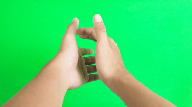 Clapping hand gesture isolated on green screen background chroma key