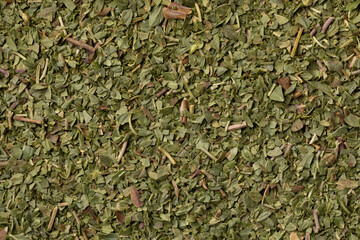 Dried chopped oregano full frame as background close up