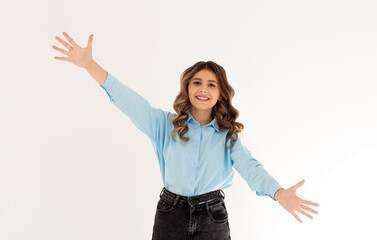 Portrait of a happy young girl with outstretched hands to embrace you isolated on a white background