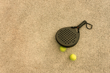 Padel tennis racket. Background with copy space. Sport court and balls.