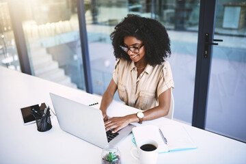Office, black woman and writer with laptop for typing, research and information for news article...