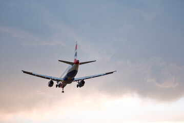 Passenger Airplane Landing Take-Off at Sunrise Dawn