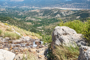 The scenic views of Gömbe Uçarsu Waterfall which  fly like a white cloud down the rocks at an...