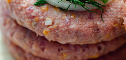 A piece of meat with a yellow cheese on it